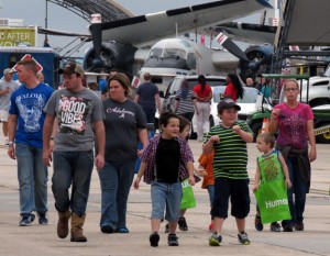 Visitors to the 2015 Blue Angels Homecoming Air Show on Saturday stroll among the static aircraft displays at the event, the final show of the performance season for the Blues.